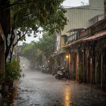 沉重的大雨像一件黑色的披肩般笼罩着城市